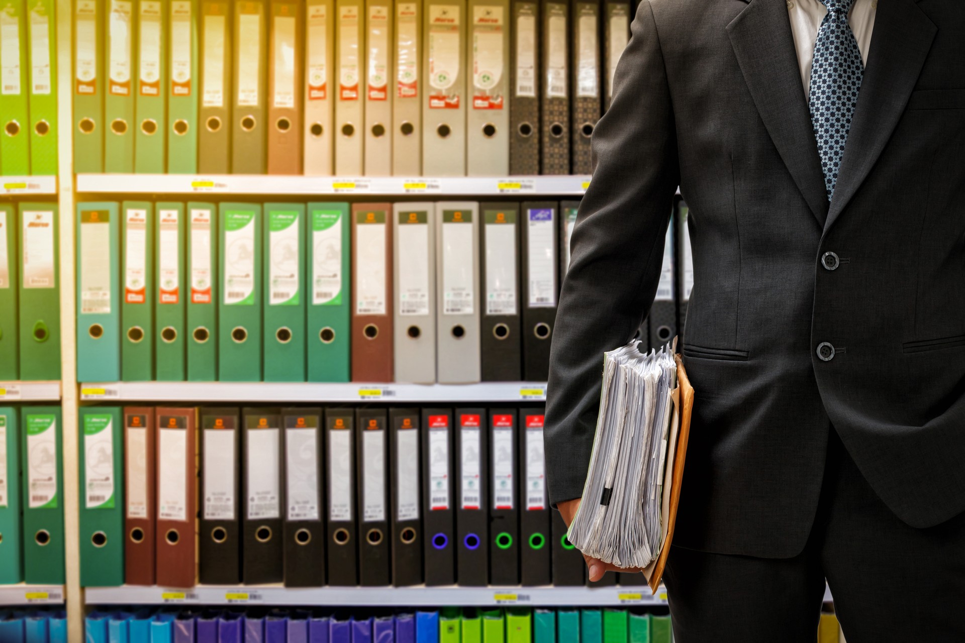 businessman holding data files